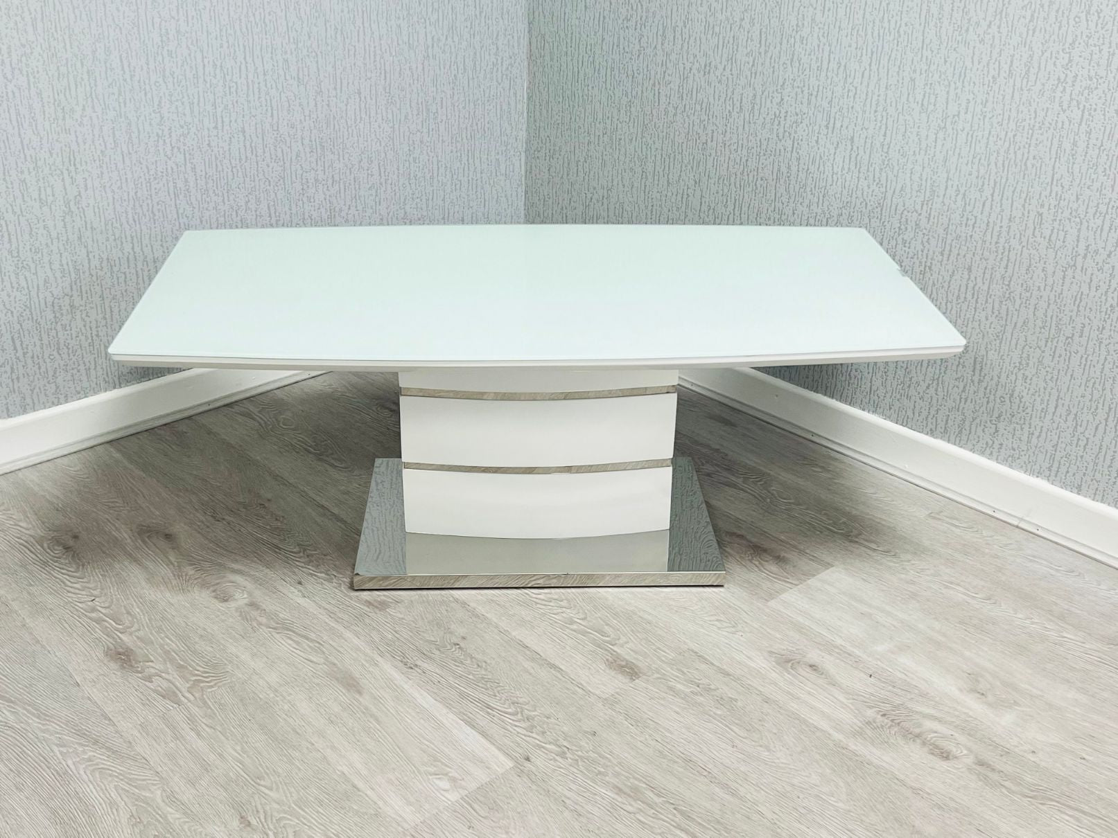 Milan White High Gloss Coffee Table with chrome-trimmed layered pedestal base - front view