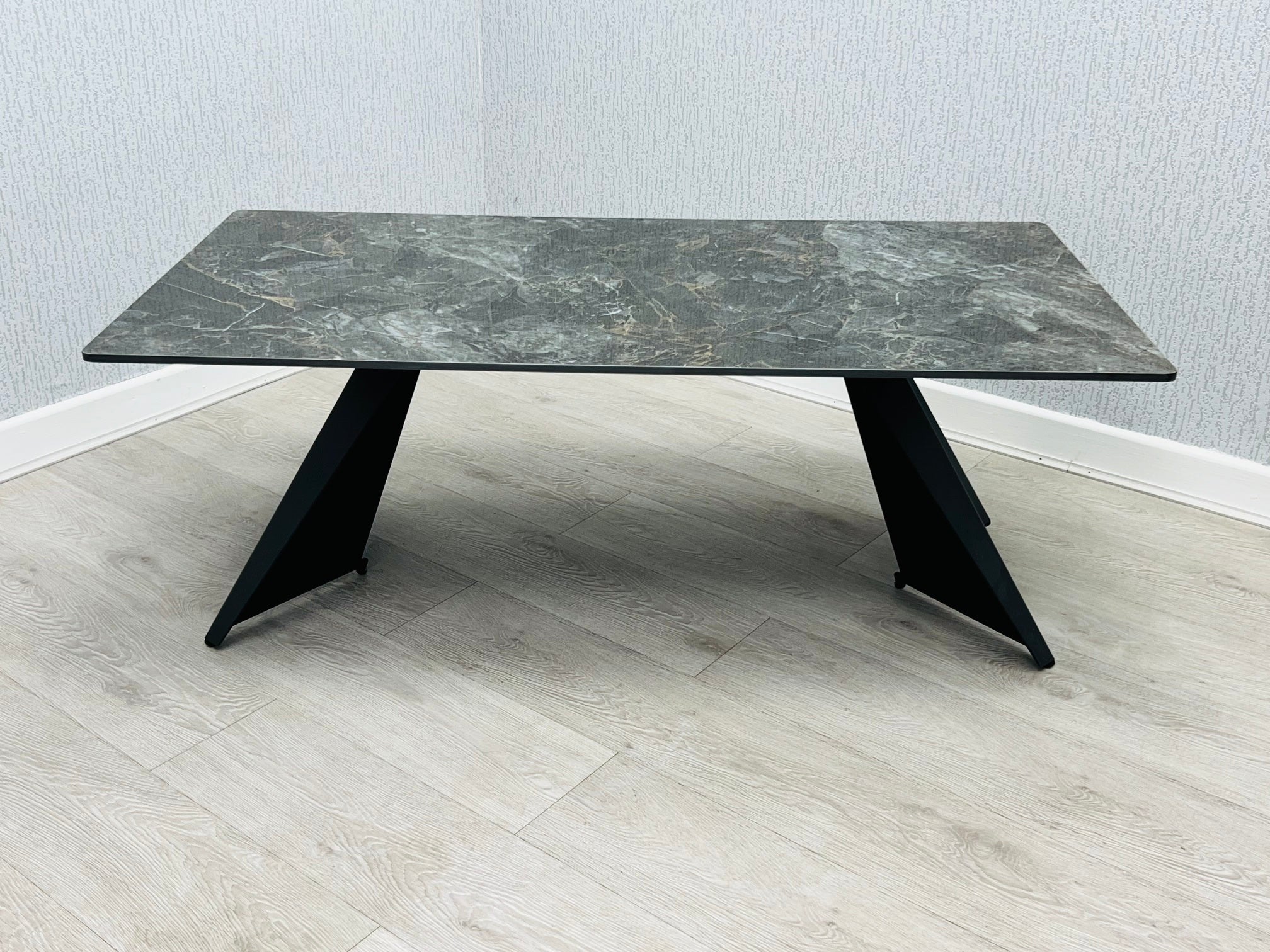 Chicago Black Ceramic Marble-Effect Coffee Table with black angular pedestal legs - angled view